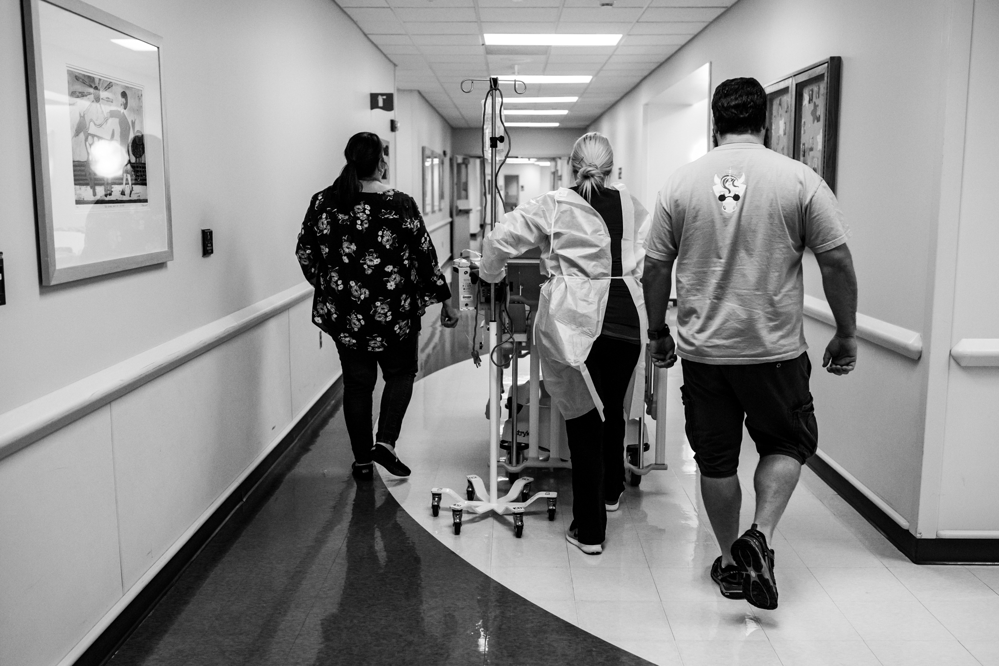 family walking down the hospital hallway